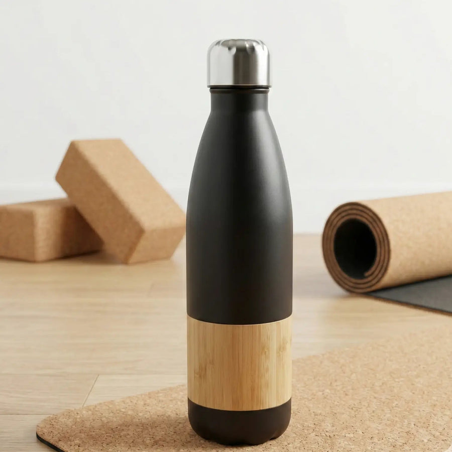 Bamboo Vacuum Flask - 500ml featuring a stylish black and bamboo design on a cork surface.