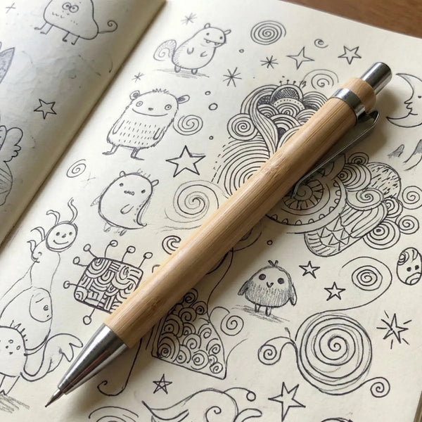 Bamboo Mechanical Pencil resting on a doodle-filled sketchbook, ideal for smooth writing and drawing.