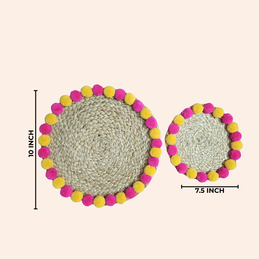 Diwali Duo Jute Weave Mat — two round jute mats with pink and yellow pompom trim, with 10 inch and 7.5 inch size labels.