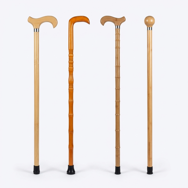 Four bamboo walking sticks side by side in derby, crook and round knob handle styles