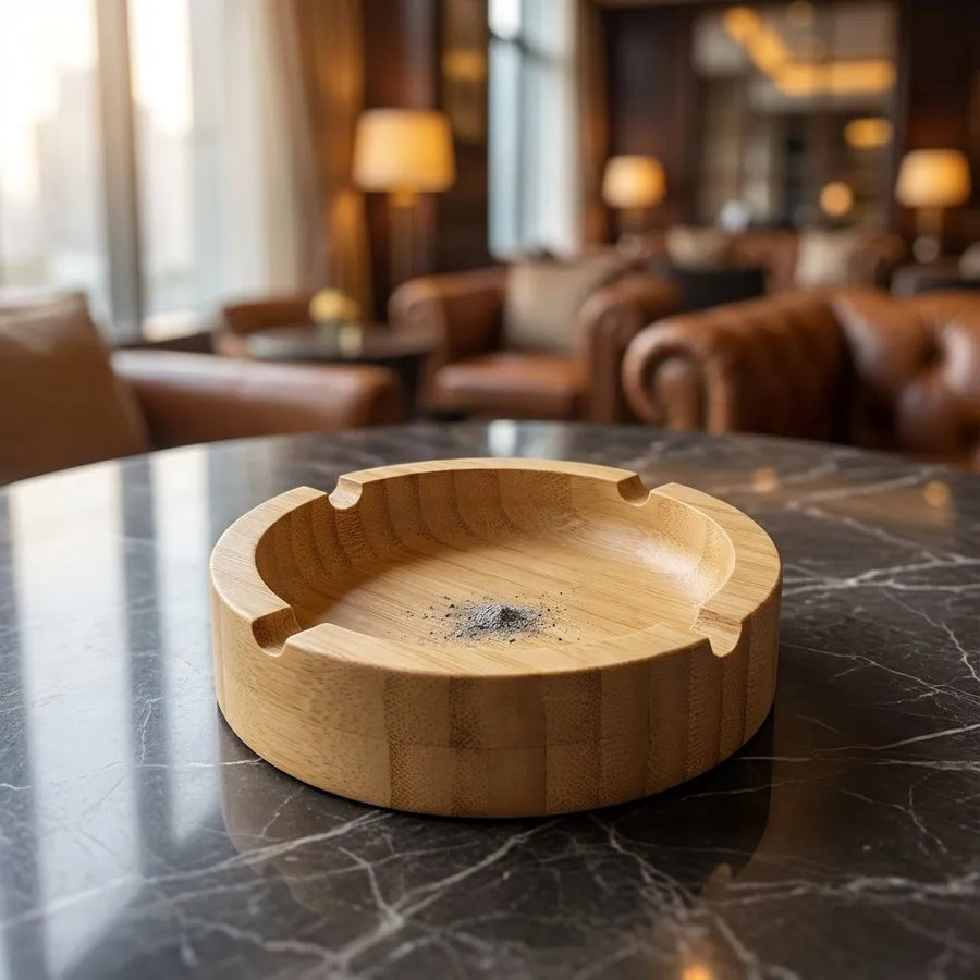 Round Bamboo Ashtray with Cigarette Rests on a marble table in a stylish lounge setting.