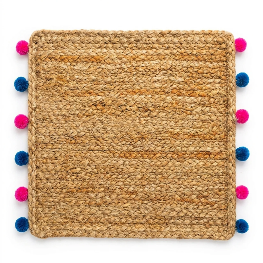 Palasha Jute Weave Mat, Blush colourway — square jute mat with pink and blue pompom trim, on a plain background.